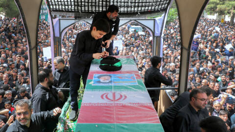 The coffin of late Iranian president Ebrahim Raisi is seen during a funeral procession in the eastern city of Birjand.