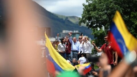 Venezuelan presidential candidate Edmundo Gonzalez Urrutia and opposition leader Maria Corina Machado during a protest rally in front of the UN headquarters in Caracas on July 30, 2024.