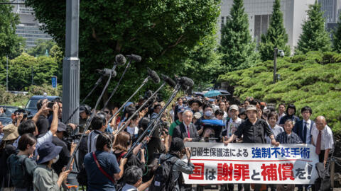 Lawyers and supporters of people forcibly sterilised under a now-defunct eugenics law march toward Japan's Supreme Court in Tokyo.