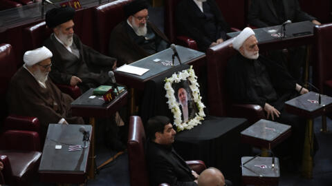 A portrait of the late Iranian President Ebrahim Raisi is placed on his seat at the Assembly of Experts in Tehran, Iran, May 21, 2024.
