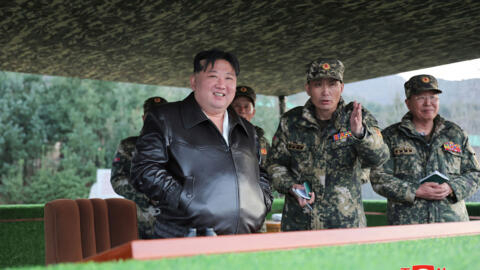 North Korean leader Kim Jong Un (L) inspecting training of the First Tank Armored Infantry Regiment on March 24, 2024.