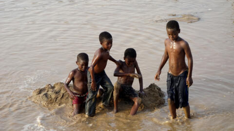 Children play in the waters of the Gash River some 600 kilometres from Sudanese capital Khartoum on June 6, 2024.