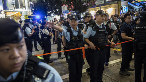 رجال شرطة في هونغ كونغ، 4 يونيو 2024.