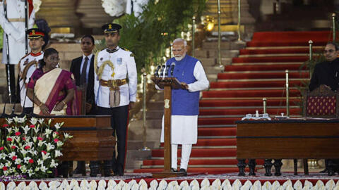 India's Prime Minister Narendra Modi takes an oath during a swearing-in ceremony at the presidential palace in New Delhi, June 9, 2024.