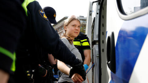 Swedish climate campaigner Greta Thunberg is detained by police, on the day climate activists try to block the A12 highway in The Hague, Netherlands, April 6, 2024. 