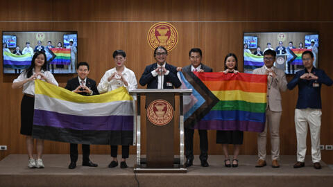 Move Forward Party parliamentary members and interns hold a presser ahead of the final senatorial vote on the same sex marriage bill at the Thai Parliament in Bangkok on June 18, 2024.