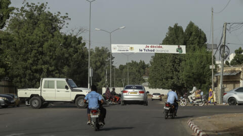 A general view of a banner saying: "I decide, Chad advances" belonging to the national commission in charge of organising a  referendum on a new constitution, in N'Djamena on December 13, 2023.