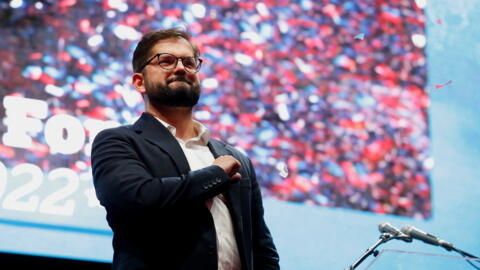 Chile's President-elect Gabriel Boric gestures as he celebrates with supporters after winning the presidential election in Santiago, Chile, December 19, 2021.