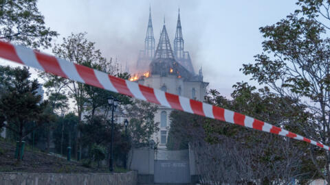 This photograph taken on April 29, 2024, in Odesa, shows a burning building damaged as a result of a missile attack, amid the Russian invasion of Ukraine.