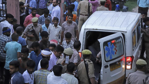 An ambulance transporting a person injured during a stampede at a religious festival arrives at the Sikandrarao hospital in Hathras district about 350 kilometers southwest of Lucknow, India, Tuesday,