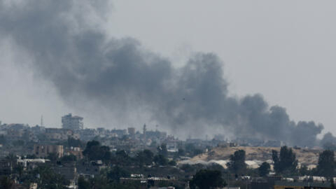 Smoke rises following Israeli strikes during a military operation in Rafah, as seen from Khan Younis, in the southern Gaza Strip on May 28, 2024.
