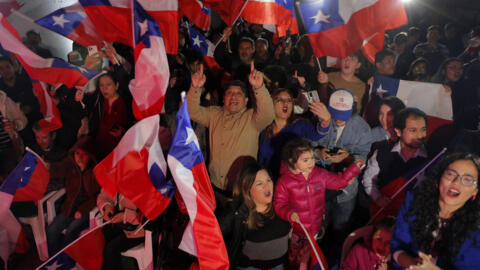 Supporters of Chile’s far-right Republican Party celebrate the victory of their candidates during an election to choose members of a Constitutional Council to draft a new constitution proposal, Santiago, May 7, 2023.