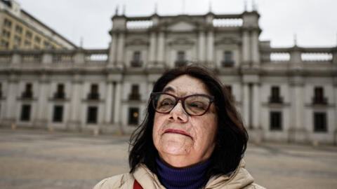 Patricia Herrera, 68, stands outside the Moneda palace in Santiago, where she was tortured during Augusto Pinochet's dictatorship.
