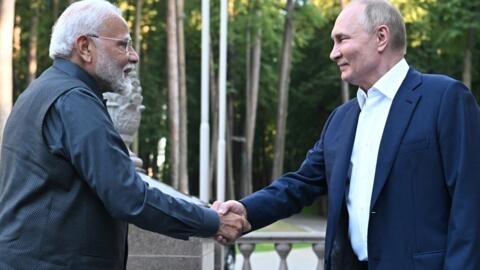 Russia's President Vladimir Putin and Indian Prime Minister Narendra Modi shake hands during an informal meeting at the Novo-Ogaryovo state residence, outside Moscow, on July 8, 2024.