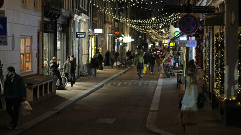 Streets start to empty in Amsterdam, the Netherlands on Saturday, Dec. 18, 2021, moments before the Dutch government announced a Christmas "lockdown" to curb the surge of Omicron cases.