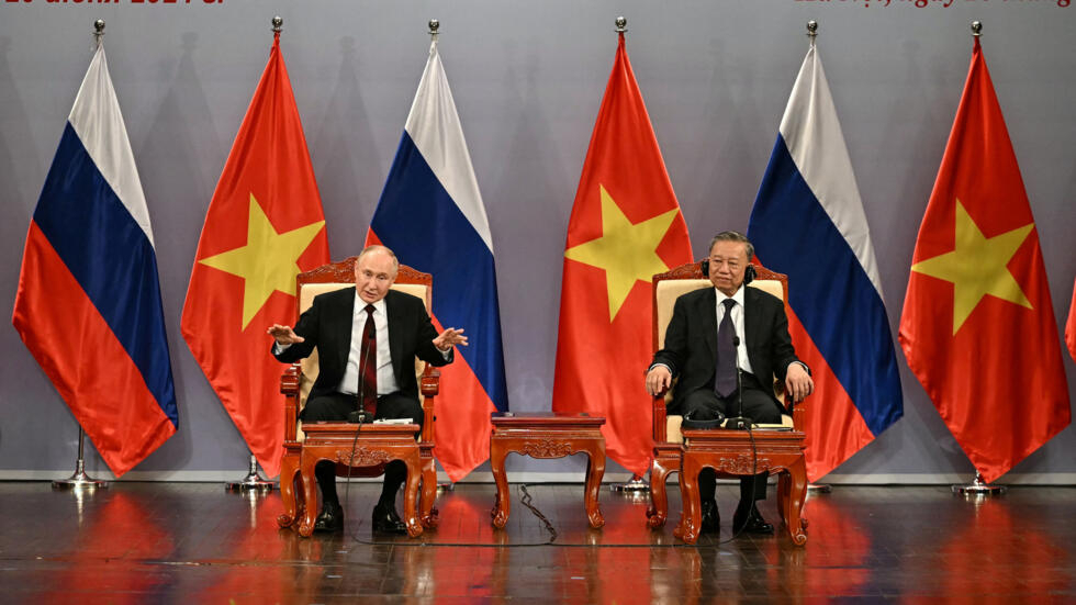 Russia's President Vladimir Putin and Vietnam's President To Lam take part in an event at the Hanoi Opera House on June 20, 2024.
