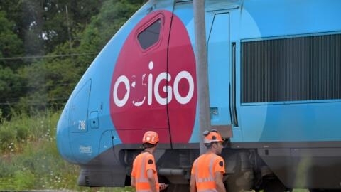 SNCF employees at work on the outskirts of Chartres, northern France on July 26, 2024, after arson attacks.