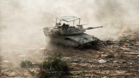 An Israeli tank is seen during operations around Jabalia in the northern Gaza Strip.