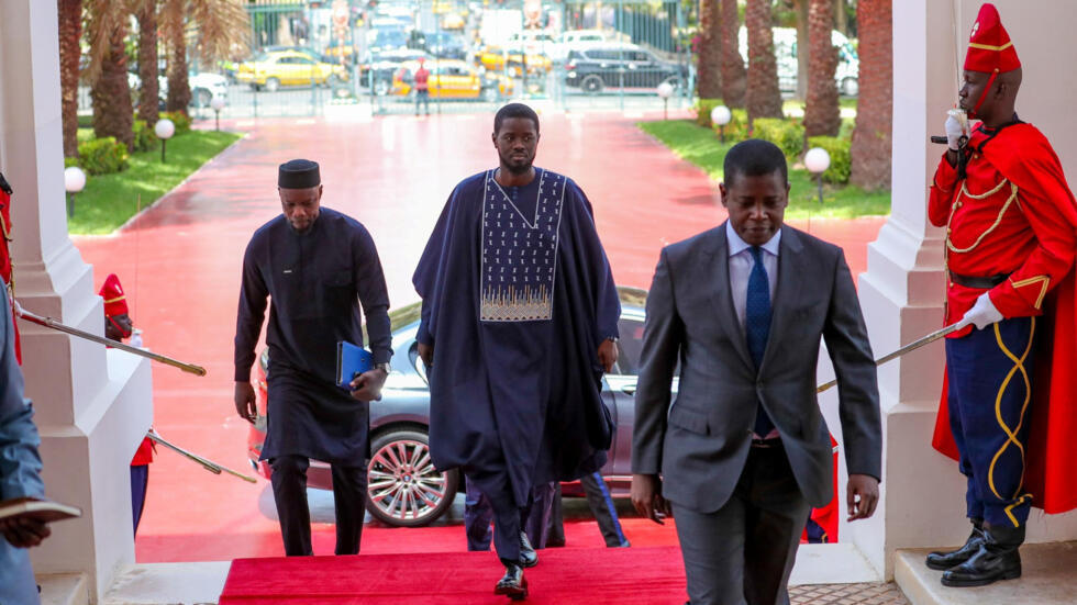 Senegal's President-elect Bassirou Diomaye Faye arrives to meet outgoing President Macky Sall (not pictured) at the presidential palace in Dakar on March 28, 2024.