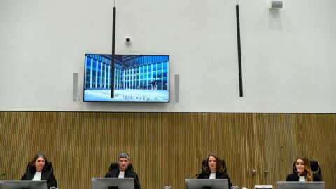 Judges at the start of the trial on June 7, 2022 of two suspects in the murder of celebrity Dutch crime reporter Peter R. De Vries.