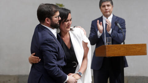 Chile's President Gabriel Boric, left, says goodbye to Izkia Siches, former minister of the interior, during a ceremony introducing his reshuffled Cabinet, in Santiago, Chile on Sept. 6, 2022.