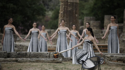 Paris 2024 Olympics - Olympic Flame Lighting Ceremony - Ancient Olympia, Greece - April 16, 2024 Greek actress Mary Mina, playing the role of High Priestess, lights the flame during the Olympic Flame