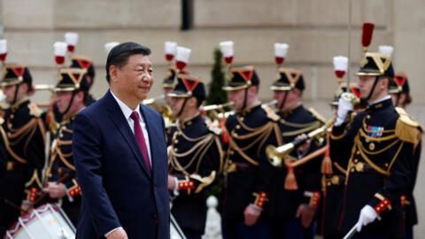 China's President Xi Jinping arrives for a meeting with French President Emmanuel Macron and European Commission President Ursula von der Leyen (not seen) at the Elysee Palace in Paris as part of the