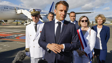 French President Emmanuel Macron speaks with the press upon arrival at Noumea ñ La Tontouta International airport, in Noumea, New Caledonia, Thursday, May 23, 2024.