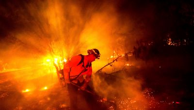 New wildfires grow in Northern California as firefighters gain ground against big blaze in the south