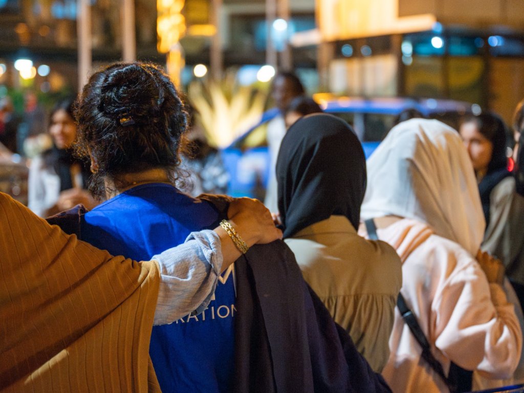 SOLA students are escorted by IOM staff members to ensure their safety during travel | Photo: ROBERT KOVACS / IOM 2024