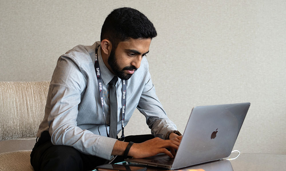 Man typing at his computer