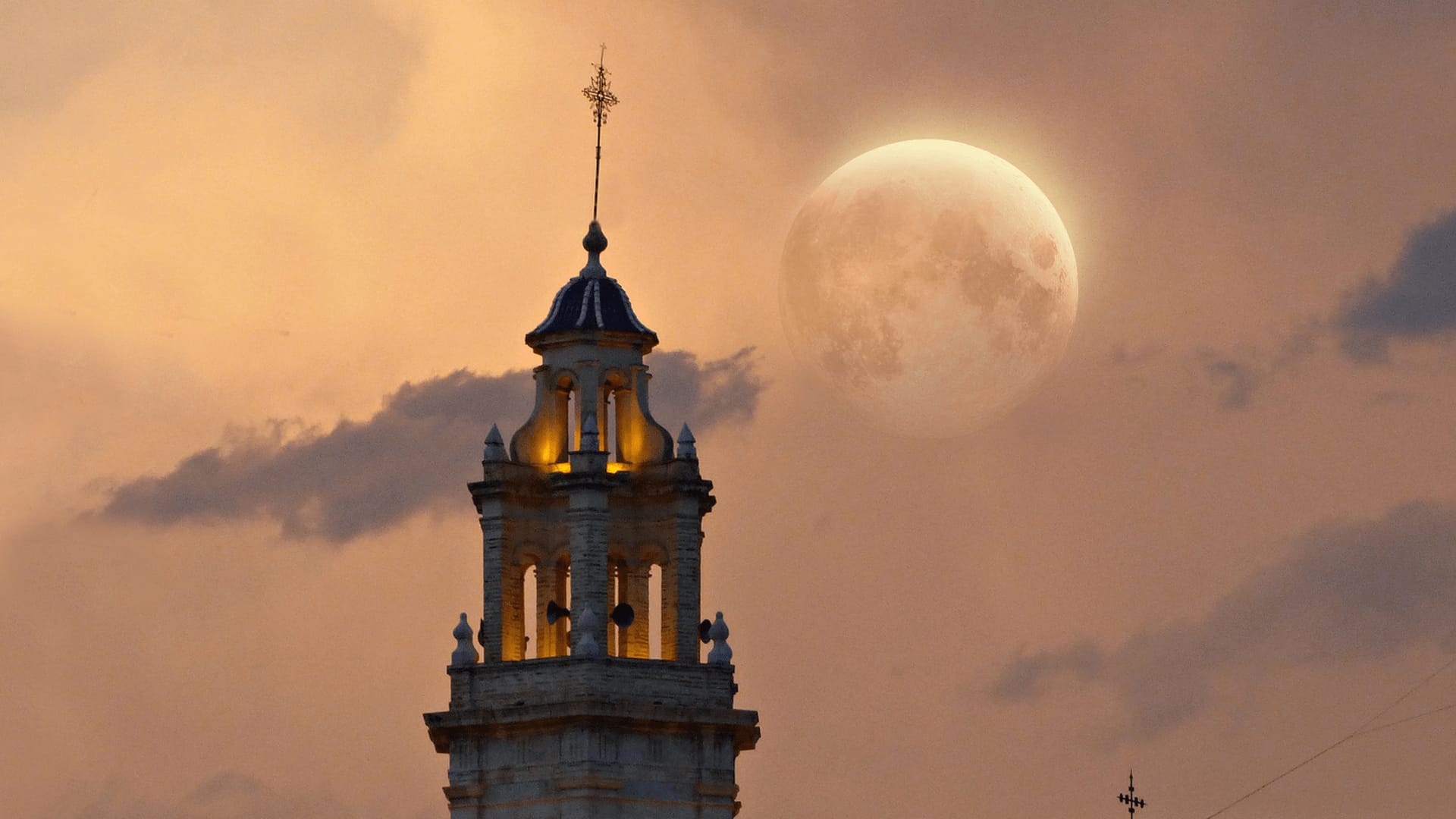 Penumbral lunar eclipse near church