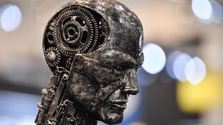 A metal head made of motor parts symbolizes artificial intelligence AI at the Essen Motor Show fair for tuning and motorsports in Essen, Germany, Friday, Nov. 29, 2019.