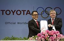 FILE - Toyota President and CEO Akio Toyoda, IOC President Thomas Bach