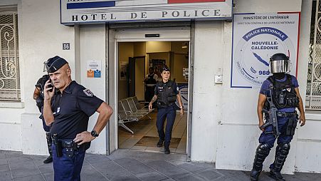 Police in the restive French Pacific territory of New Caledonia rounded up 11 people on Wednesday, including an independence leader, who are suspected of having a role in the 