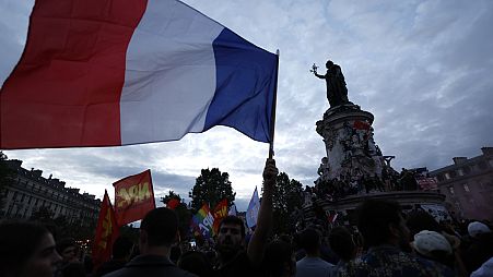 People gather on the Republique plaza following the second round of the legislative elections, Sunday, July 7, 2024 in Paris.