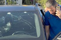 A police officer inspects a car in which a hand-held pager exploded, in Beirut, 17 September 2024