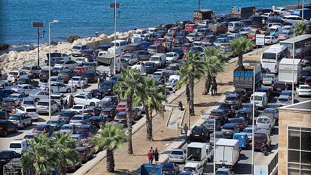 Cars sit in traffic as people flee the southern villages amid ongoing Israeli airstrikes, in Sidon, 23 September 2024