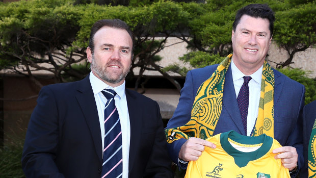 Marinos and McLennan pose for a photo at September's announcement that Australia would host the Rugby Championship. 