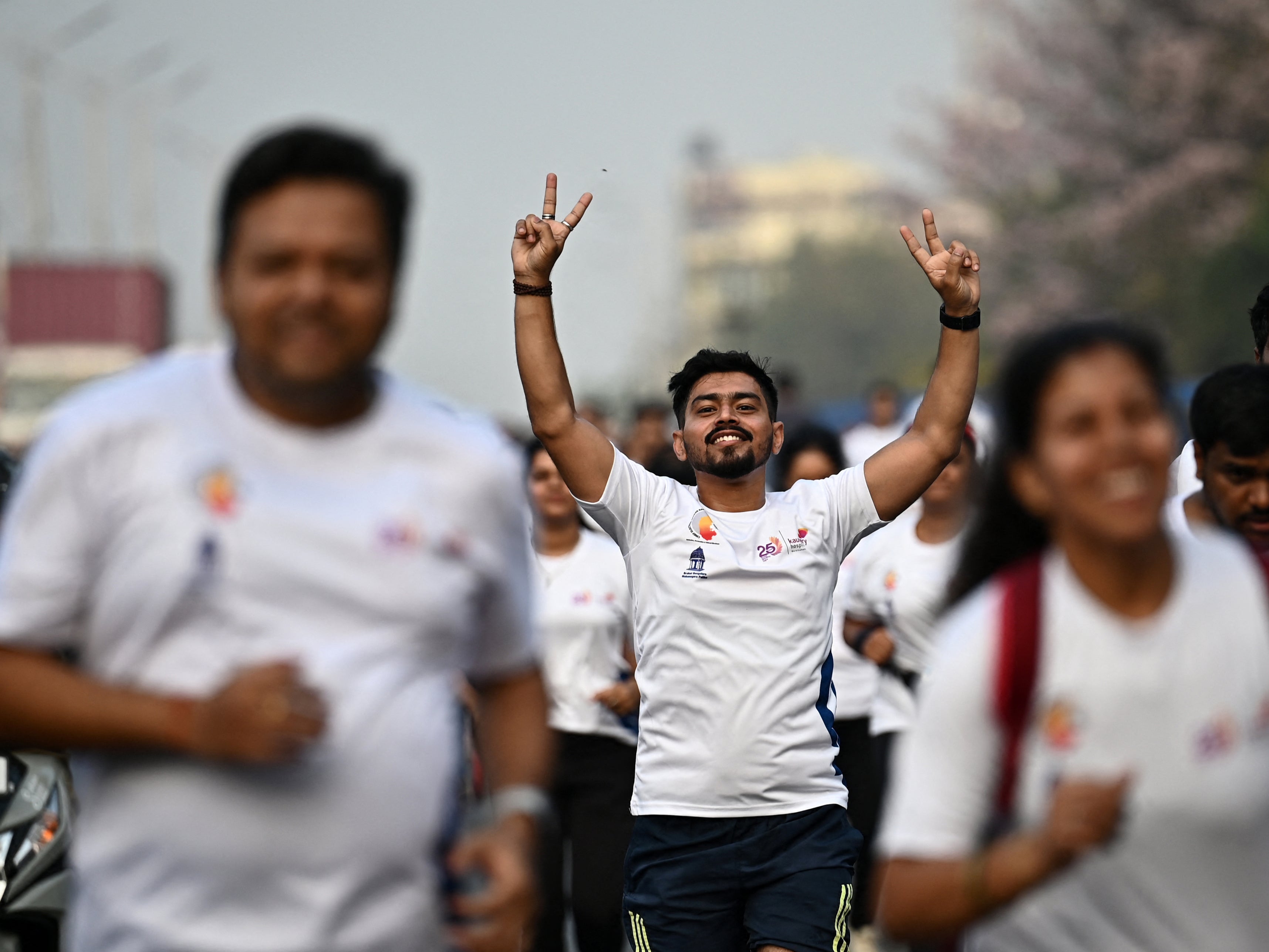 Participants walk down a road during the Vote-A-Thon, an awareness campaign organised by the Karnataka’s Chief Electoral Office to encourage 100 per cent voting turnout for the upcoming 2024 general elections, in Bengaluru on 17 March 2024