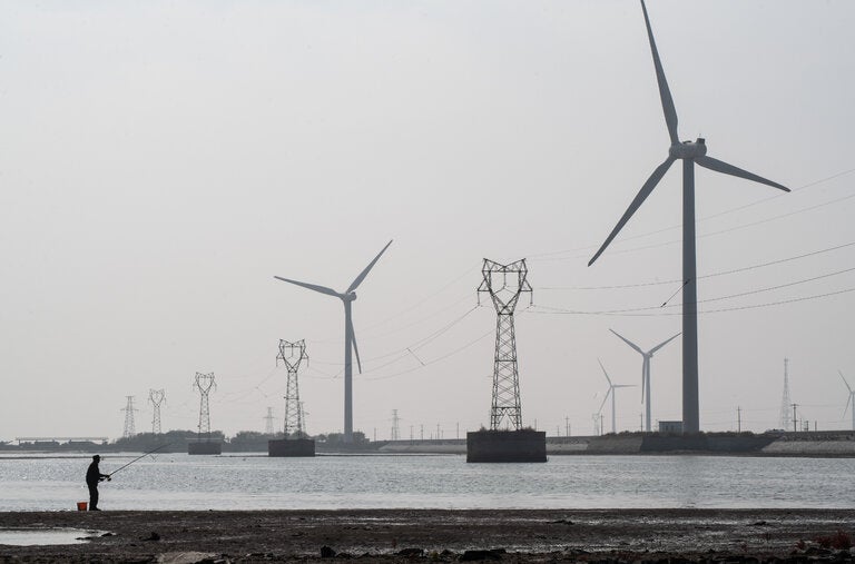 A wind farm along the shore of the Bohai Sea in Shandong Province, China.
