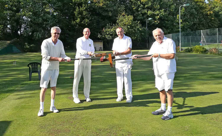 The players touching mallets before play, From L to R, Mervyn Harvey, Philip Wood, Adrian Morris and Cliff Daniel