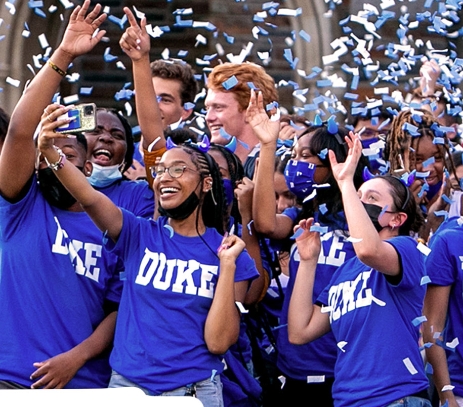 students celebrating with blue and white confetti