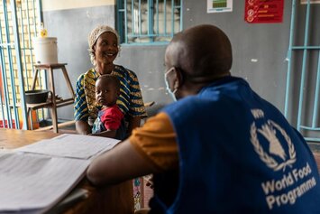 Senga waits in a local clinic with her son Maitre in Kalemie, Democratic Republic of Congo on 19th February 2021.  © WFP/Arete/Fredrik Lerneryd
