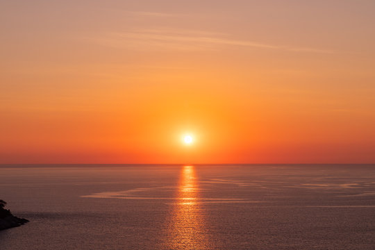 Beautiful sunset on Andaman sea at Windmill View Point near Laem Promthep Cape, Phuket, Thailand