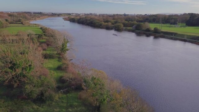 Aerial dolly captures rowers practicing in the River Corrib, Galway.