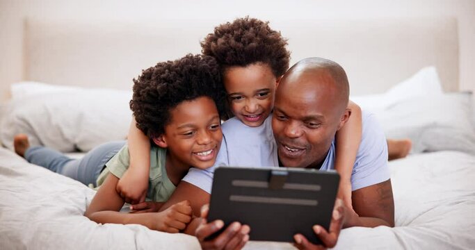 African father, smile and kids on tablet in bedroom, learning or watch funny cartoon. Black children, tech and dad on bed, website app and family laugh together, relax or bond on social media in home