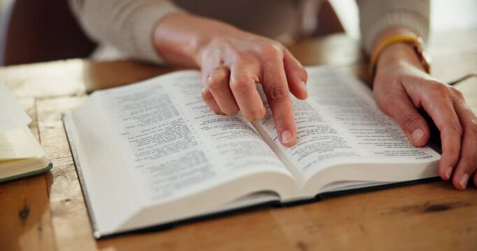 Hands, book and bible study in home for religion, peace or learning on spiritual journey in morning. Person, research or scripture for worship in house, gratitude and search for inspiration in gospel