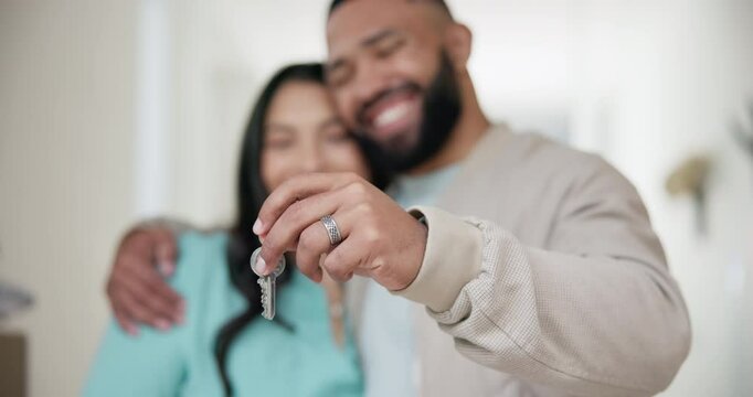 Hands, couple and keys in new home for moving, real estate investment and security for future. Closeup, man and woman hug to celebrate deal for property, house building and finance for mortgage loan