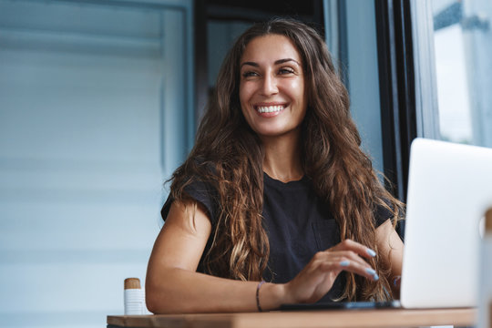 Young businesswoman manage business from home on remote, freelancer using laptop sit kitchen table on self-quarantine, work over personal growth, apply for online courses to learn new skills